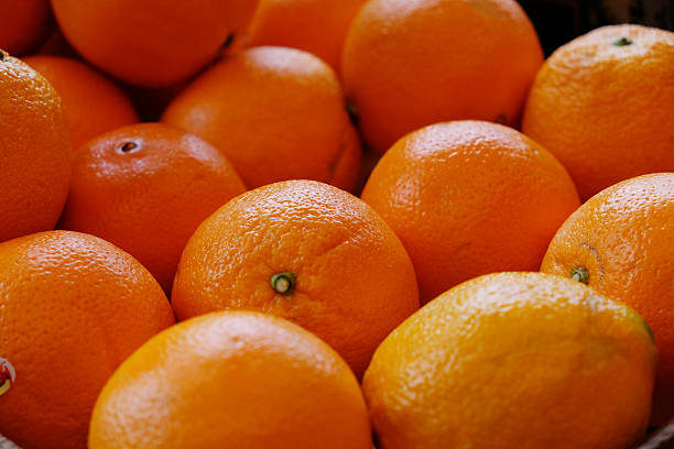 Pile of fresh, ripe, large oranges