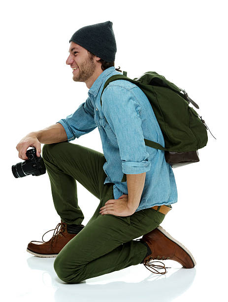 istock Smiling photographer in action with camera 532966618