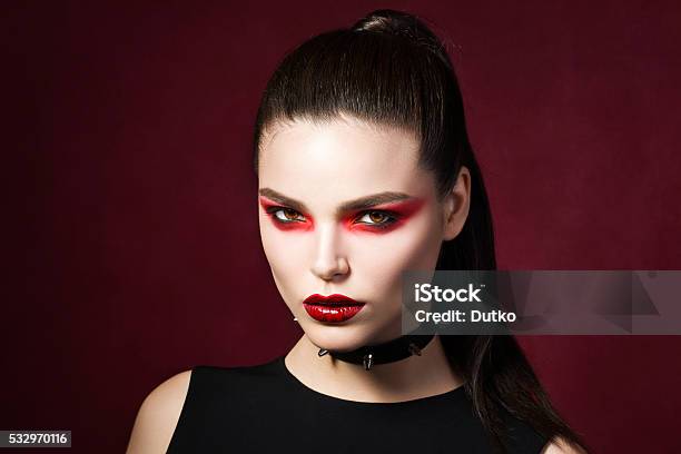 Young Beautiful Gothic Woman With White Skin And Red Lips Stock Photo - Download Image Now