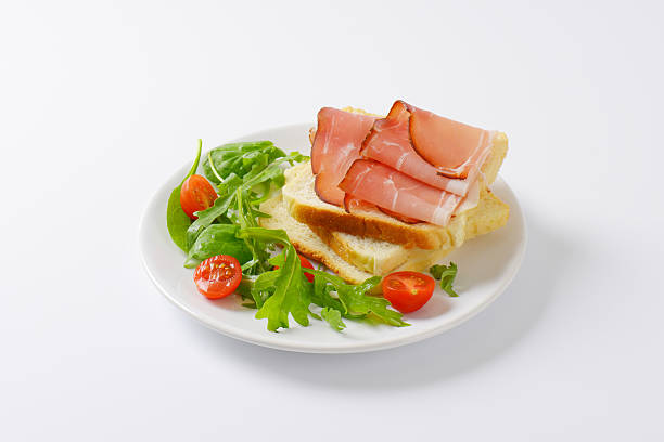 istock bread with ham and salad greens 532970512