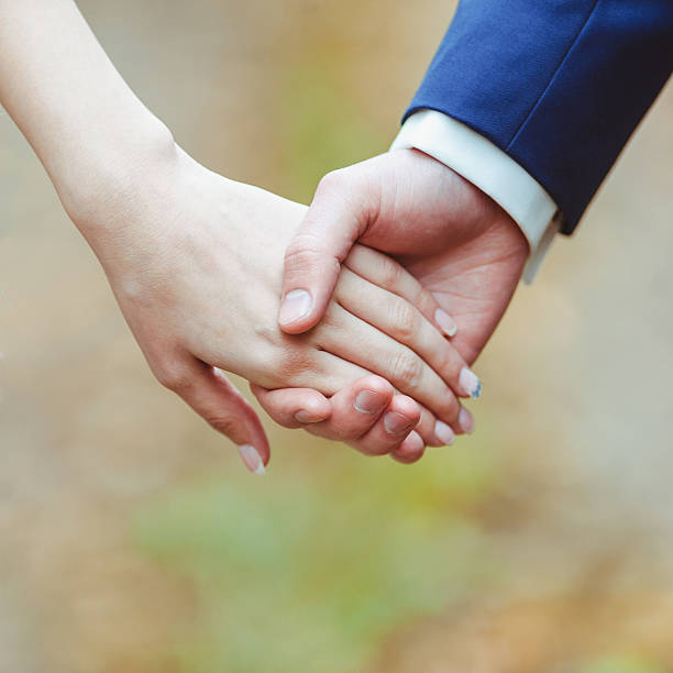 istock Man and woman holding by hands 532970800