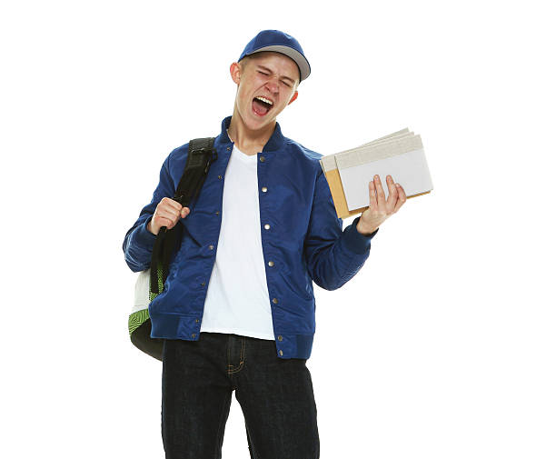 istock Excited male student holding books 532975210