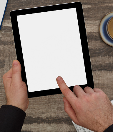 Man holding a digital tablet with blank screen
