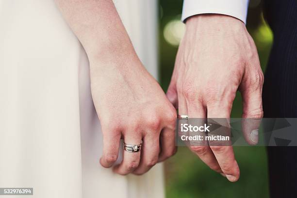 Closeup Of Bride And Groom Holding Hands Stock Photo - Download Image Now - Ring - Jewelry, Wedding, Adult