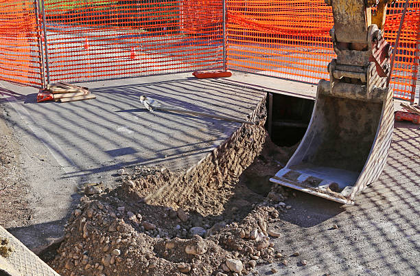 istock mechanical arm of the Digger in the roadworks 532978092