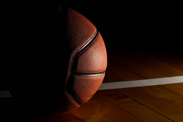 istock Basketball on court black background 532978424