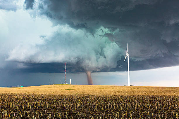istock Dangerous tornado with wind generator and communications towers 532978976