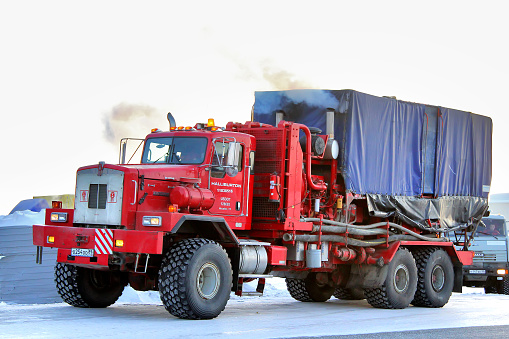 Novyy Urengoy, Russia - February 24, 2013: Red Kenworth T800 truck of the Halliburton oil field service company parked at the city street.