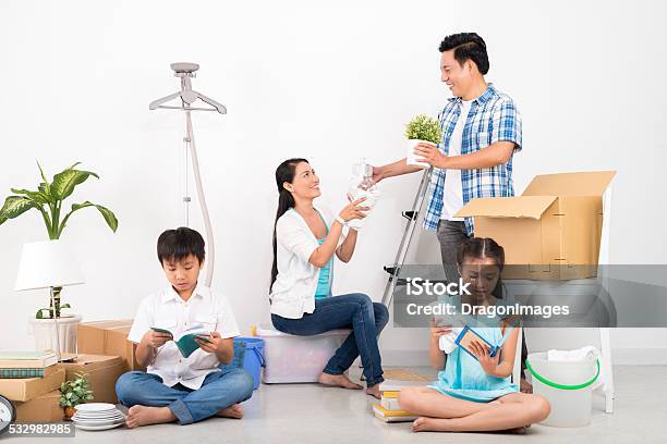 Unpacking Stock Photo - Download Image Now - 2015, Adult, Asian and Indian Ethnicities