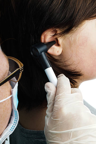 istock Ear doctor examines a child 532984513