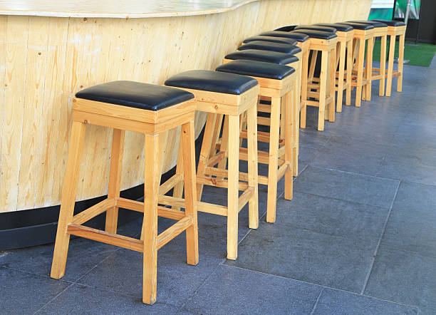 istock Lined up of wooden bar stools 532984637