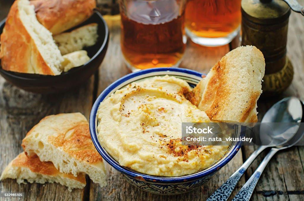 hummus hummus on a dark wood background. tinting. selective focus 2015 Stock Photo