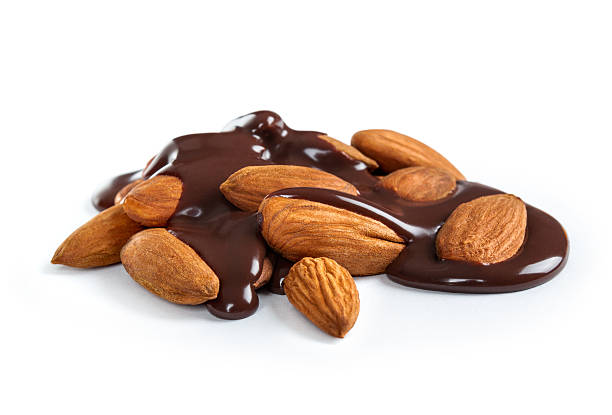 istock Pouring hot melted chocolate and almond nuts 532986803