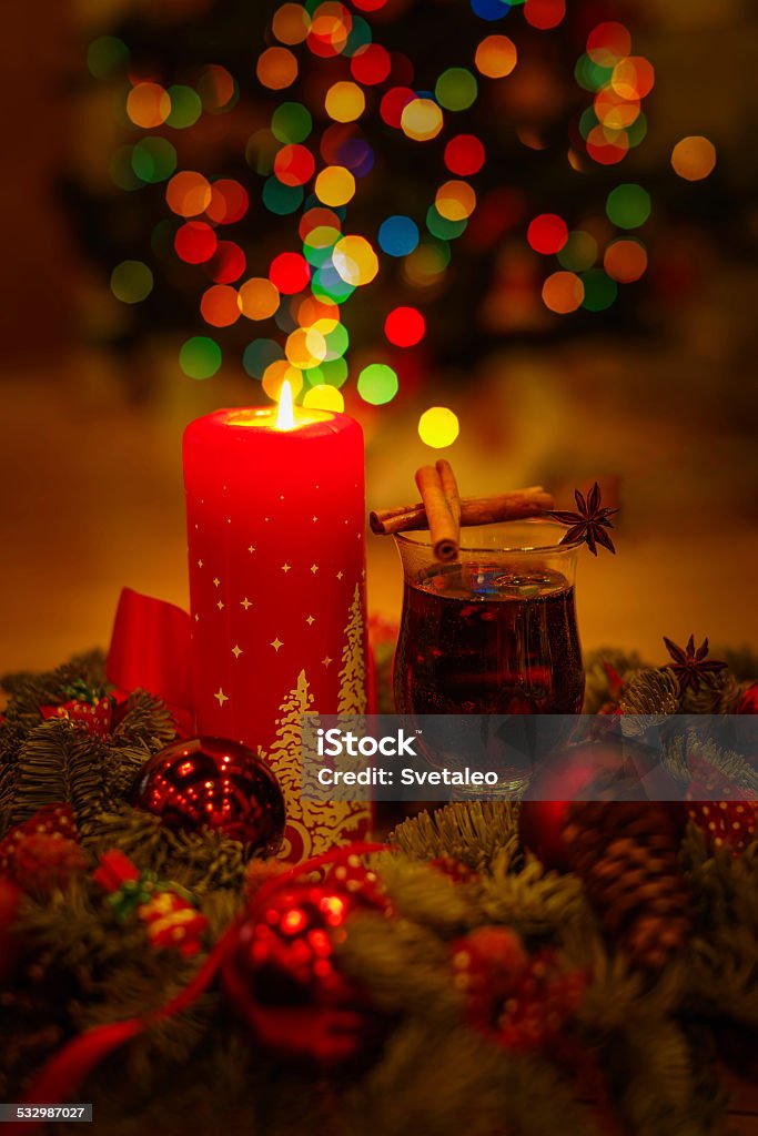 Christmas cosy homy still life Red candle and a mug of mulled wine 2015 Stock Photo