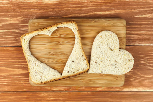 istock Slice of cereal toast bread with cut out heart shape 533004573