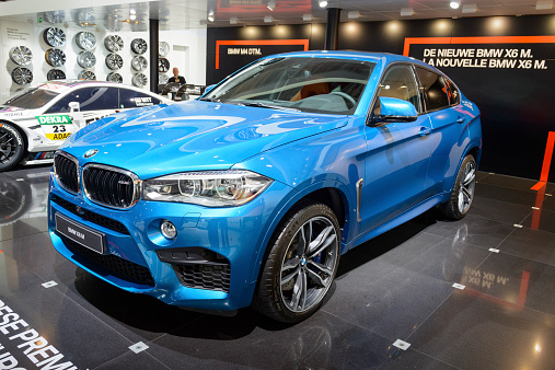Brussels, Belgium - January 15, 2015: Blue BMW X6 M luxury crossover SUV car on display during the 2015 Brussels motor show.