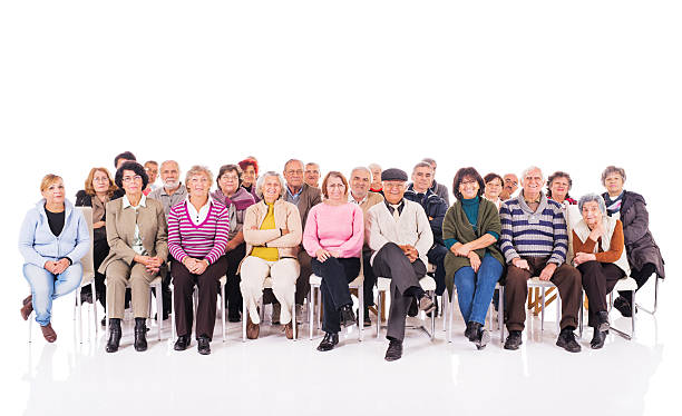 Group of happy seniors isolated on white.