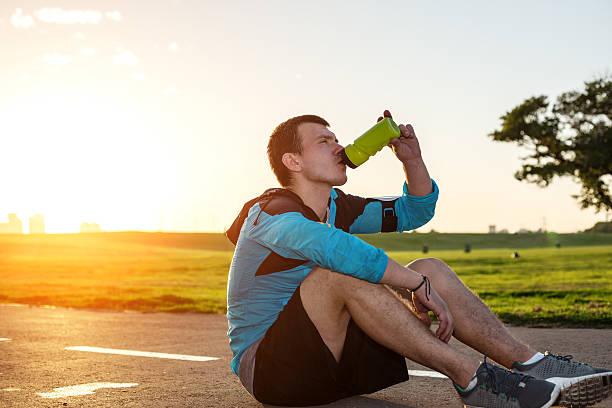 istock sportsman drinking water in the park 533009907