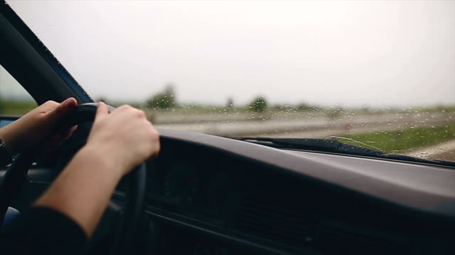 Man driving car and listening music