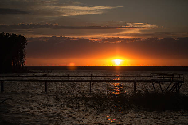 istock Wooden pier at sunset 533028737