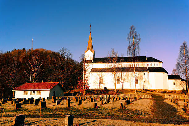 istock Cemetery with old wooden church 533029877