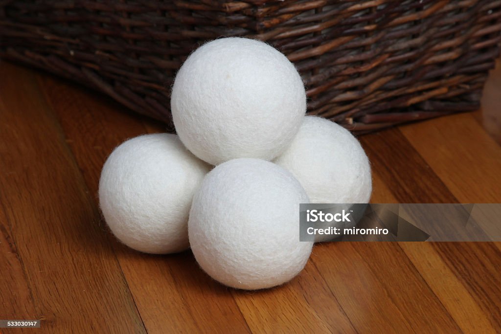 Sheep dryer ball Sheep dryer ball on wooden floor Dryer Stock Photo