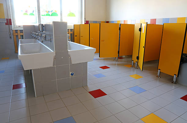 bathroom of the nursery school with white ceramic sinks