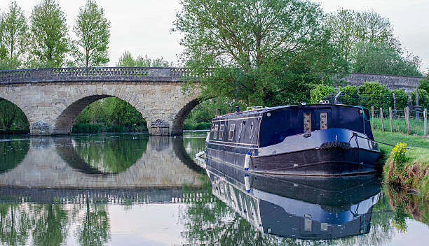 istock Barge boat moored up next to bridge 533032355
