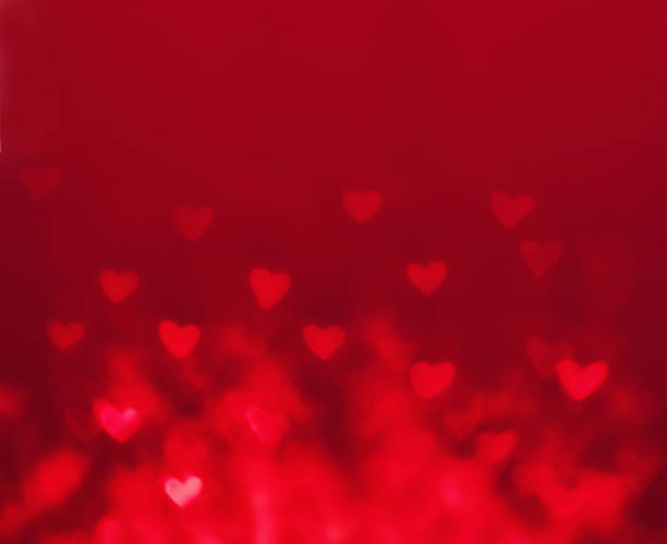 istock Abstract Valentine's day background with red hearts. Glow Colorf 533033715