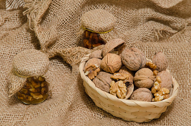 istock Walnuts in wood basket and nuts jam 533033753
