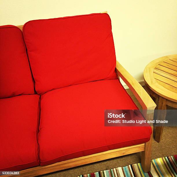 Red Sofa And Wooden Table Stock Photo - Download Image Now - 2015, Bright, Carpet - Decor