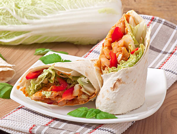 istock Burrito with chicken, beans, tomatoes and sweet peppers 533034839