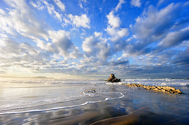 Boccale castle and the sandstone rocks of Romito during a storm at sunset. Long exposure photography. Livorno, Tuscany region, Italy, Europe