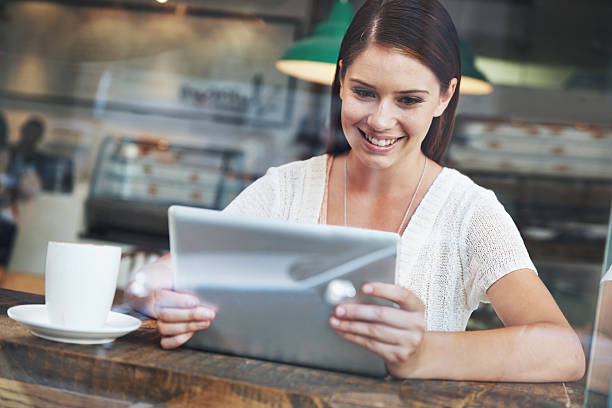 istock Online at her favorite coffee shop 533035409
