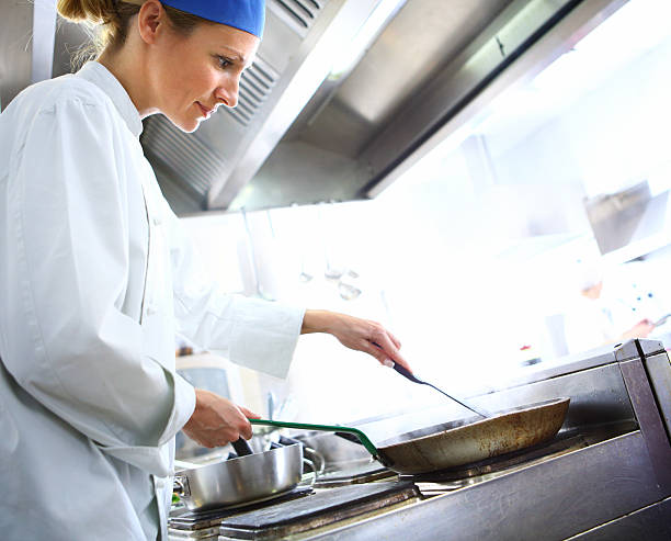 istock Professional female chef cooking in restaurant. 533036315