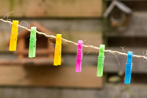 istock Colored plastic clothes pegs on the clothesline. 533040720
