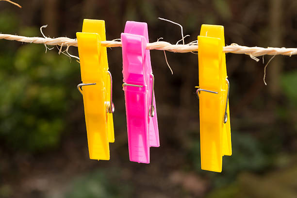 istock Colored plastic clothes pegs on the clothesline. 533040758