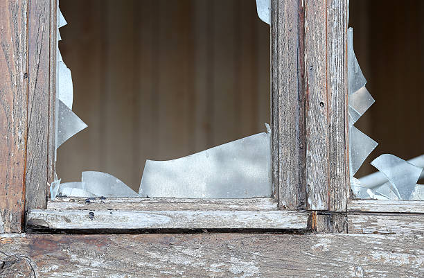 istock broken glass of a window in an abandoned house 533040848