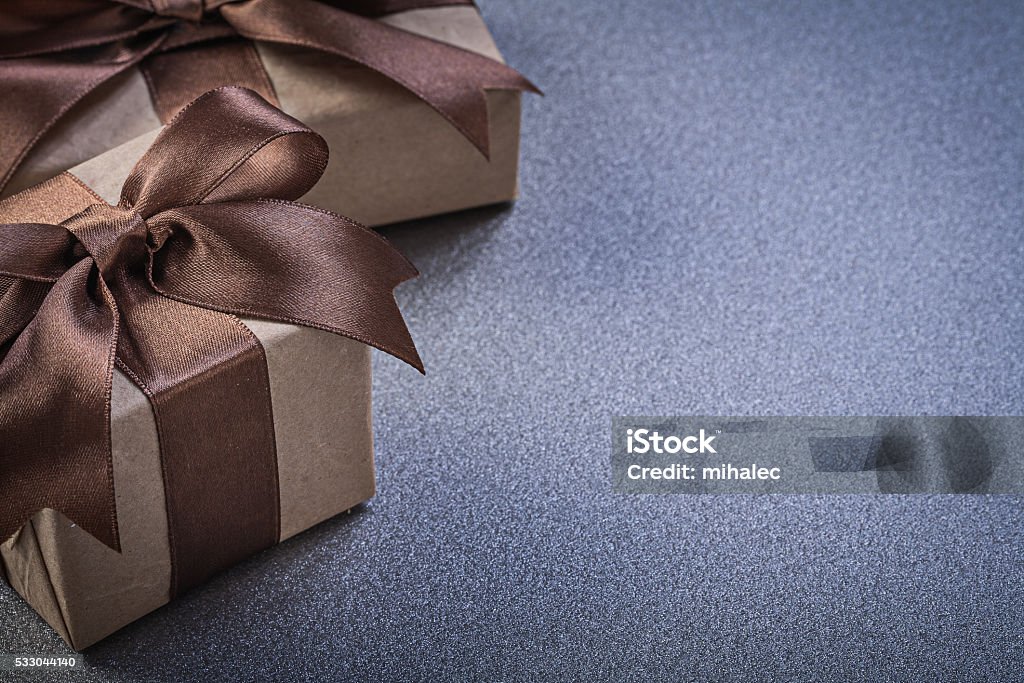 Set Of Gift Boxes In Brown Wrapping Paper On Grey Stock Photo - Download  Image Now - Anniversary, Birthday, Birthday Present - iStock