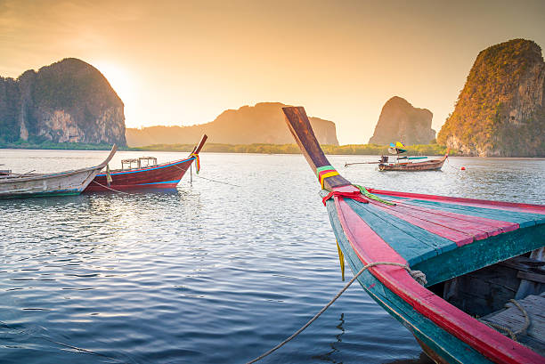 istock Beach and tropical sea with long-tail boat in thailand 533047154