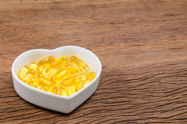 istock fish oil in heart shape bowl 533047304