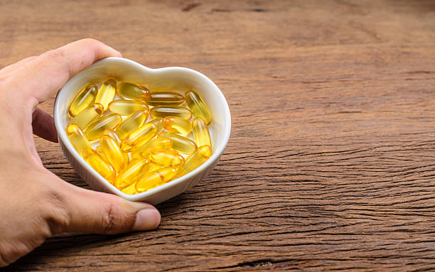 istock fish oil in heart shape bowl 533047446