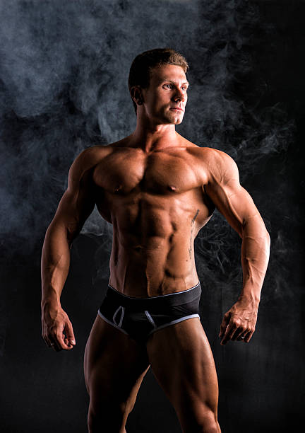 istock Attractive shirtless muscular man standing in underwear 533048143
