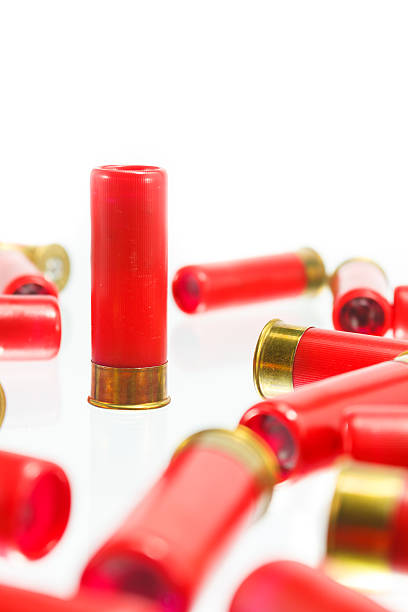 istock red shotgun shell bullet on a white background. 533049239