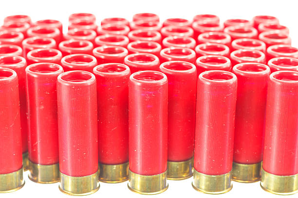 istock red shotgun shell bullet on a white background. 533049775