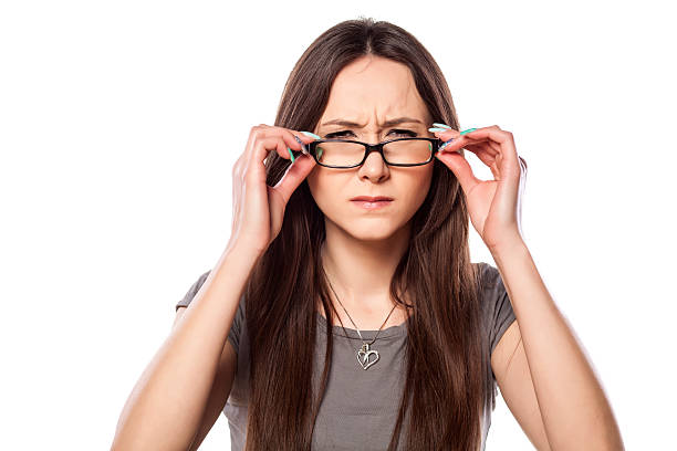 istock Frowning young woman adjusting her glasses 533049815