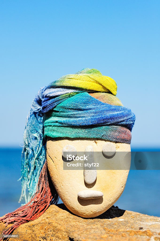 Coloured bandana Image of stone head with a coloured bandana 2015 Stock Photo