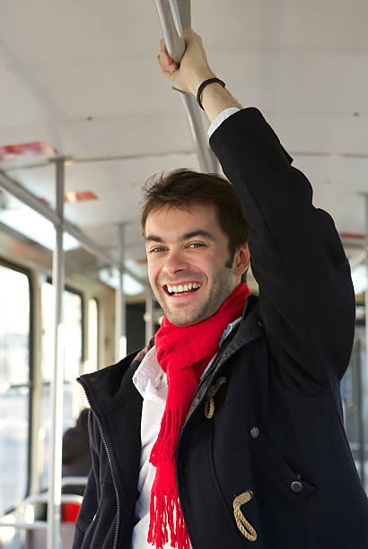 istock Smiling young man taking public transport 533049943