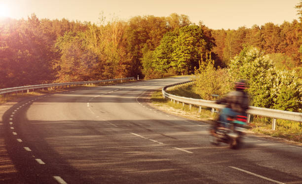 istock Motobike on asphalt road in beautiful summer evening 533050568