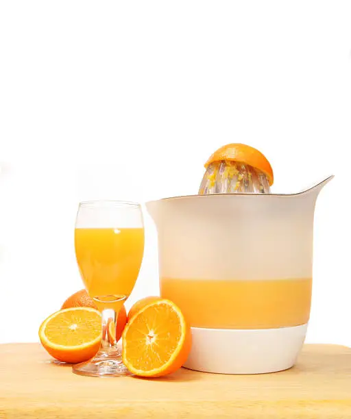 Juicing oranges and juicer